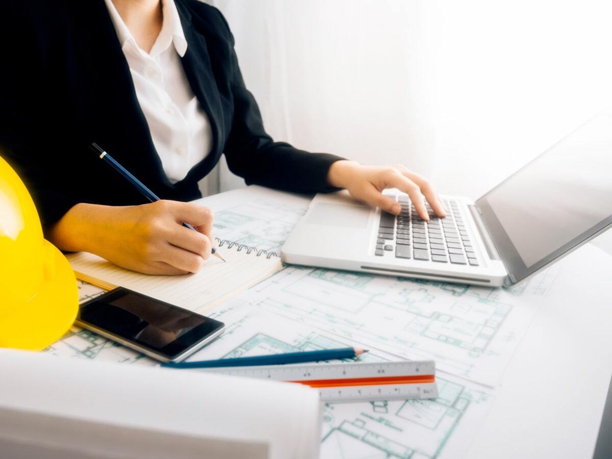 VPO-inset-woman-desk-hardhat-laptop-min