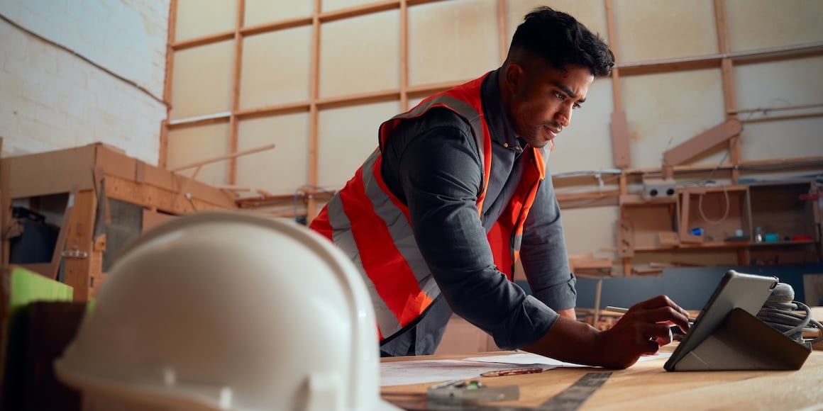 Construction firm director using project management information system