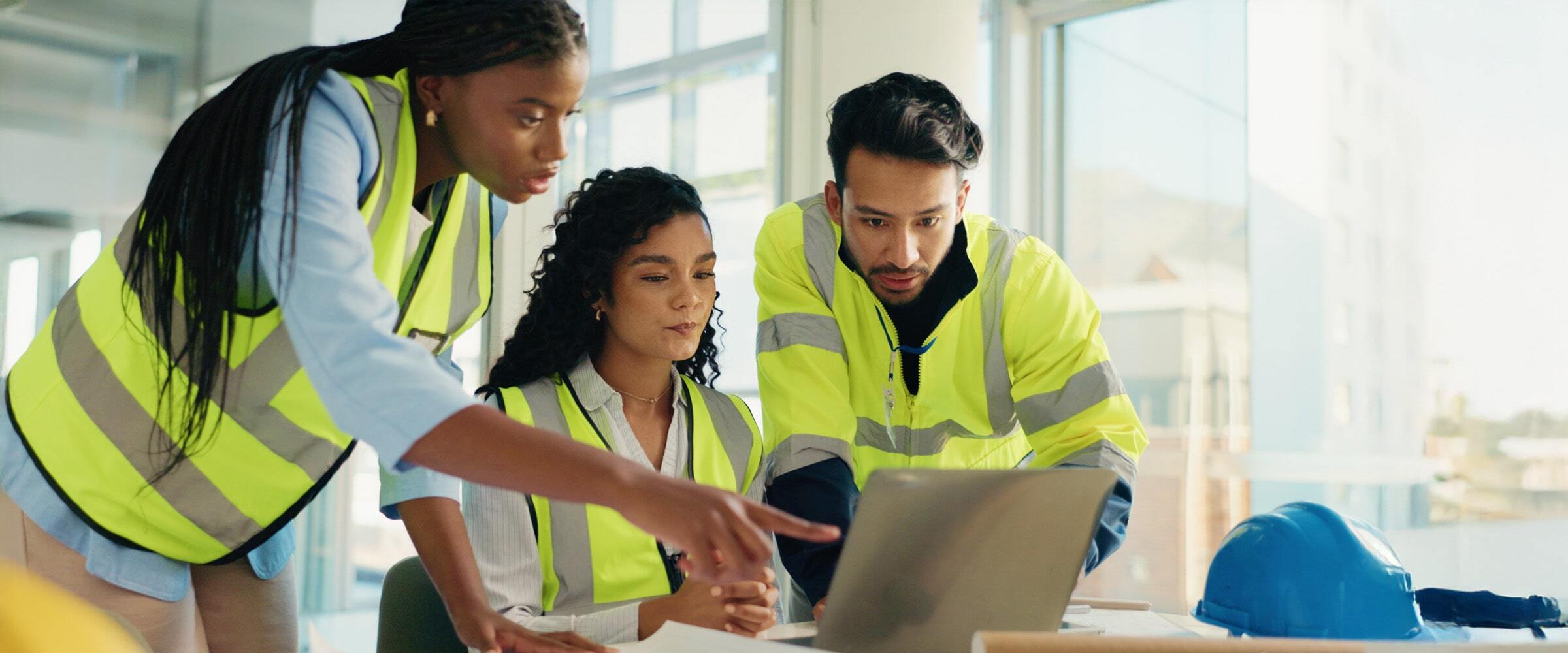 VPO-banner-team-office-desk-vests-laptop-min