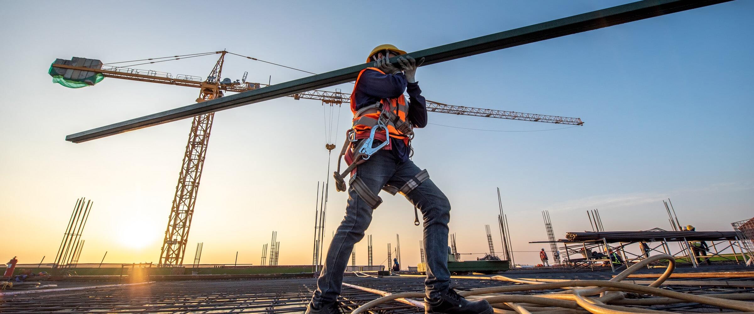 VPO-banner-worker-carrying-beam-min